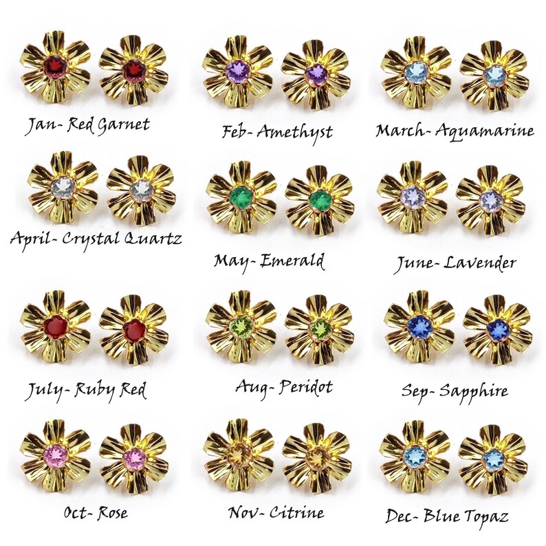 May include: Twelve pairs of gold-tone flower-shaped stud earrings, each featuring a different colored gemstone representing birthstones from January to December, labeled with month names and stone types including garnet, amethyst, aquamarine, and topaz.