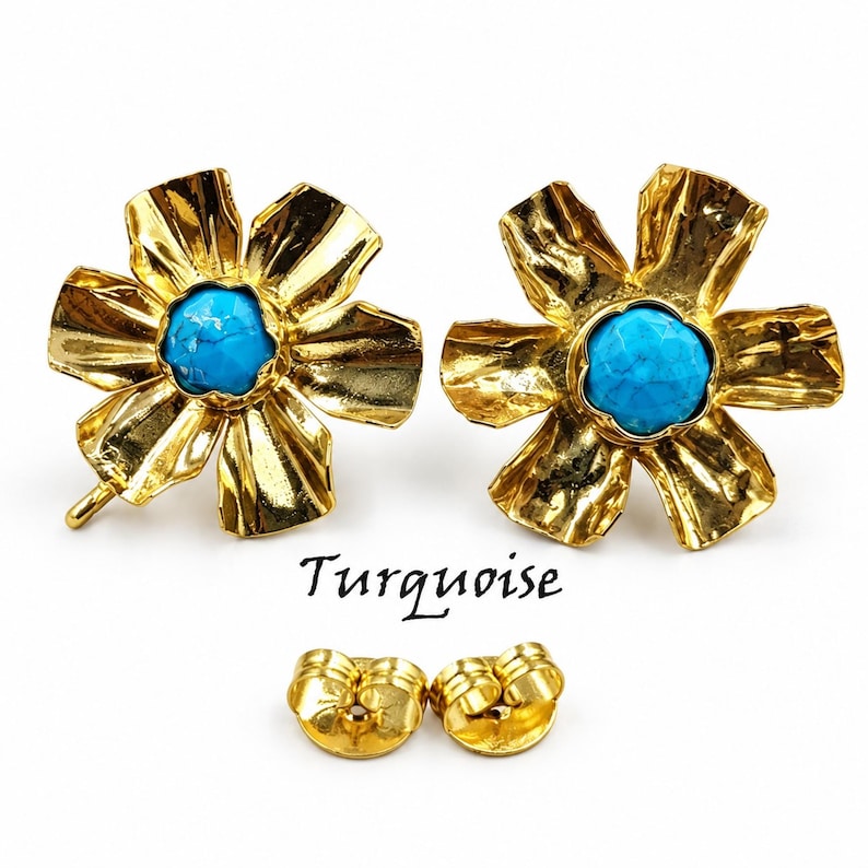 May include: A pair of gold-toned flower-shaped stud earrings featuring a central round turquoise stone. The petals have a textured, hammered finish. The word Turquoise is printed below the earrings, accompanied by two gold-toned earring backs.