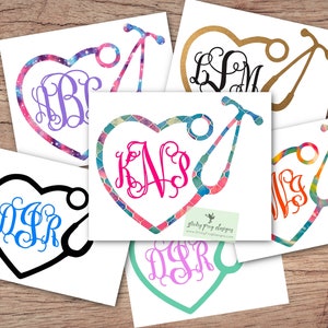 May include: Five different designs of heart-shaped vinyl decals with a stethoscope and monogrammed initials. The decals are on a white background and feature different patterns and colors.