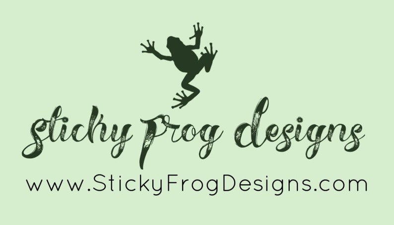 May include: A green frog silhouette jumps above the text "sticky frog designs" and the website address "www.StickyFrogDesigns.com".