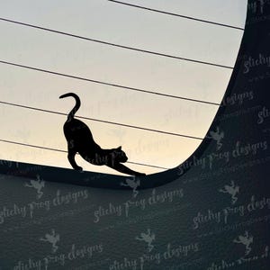 May include: A black cat silhouette stretching on a curved surface, set against a backdrop of horizontal lines and a gradient sky. The cat's arched back and extended front paw are clearly defined.
