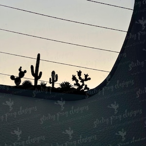 May include: Silhouette of a desert landscape with cacti and succulents. The cacti are in various shapes and sizes, including a tall, slender cactus and a short, round cactus. The succulents are clustered together in the foreground. The image is in black and white.