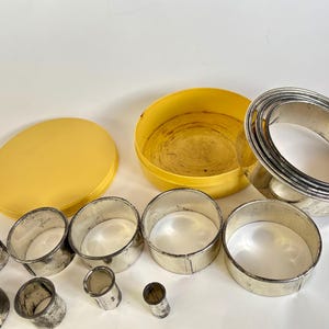 Vintage Round Biscuit Cutter Set: 14 Nesting Cutters in Yellow Tin