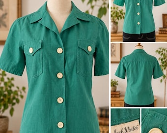 May include: A short-sleeved emerald green button-down shirt with a collared neckline, two chest pockets with button flaps, and light-colored buttons. The interior label reads Jack Winter California size 6, showing a classic tailored construction.