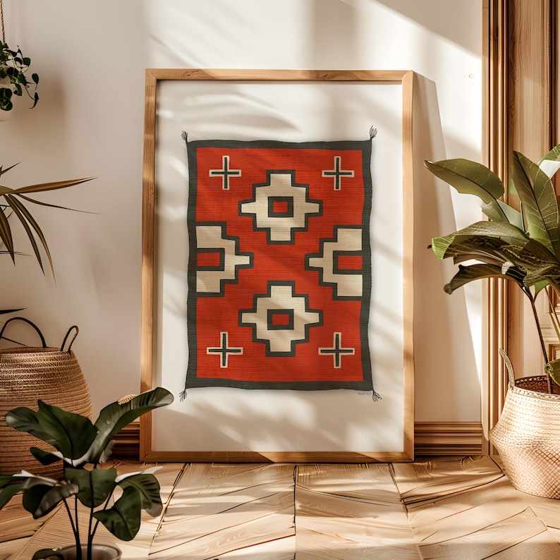 May include: A framed print of a red, white, and black geometric pattern. The pattern is reminiscent of a Native American rug or blanket.