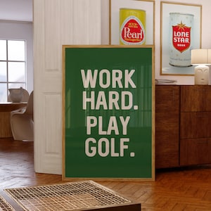 May include: A green poster with white text that reads "WORK HARD. PLAY GOLF."