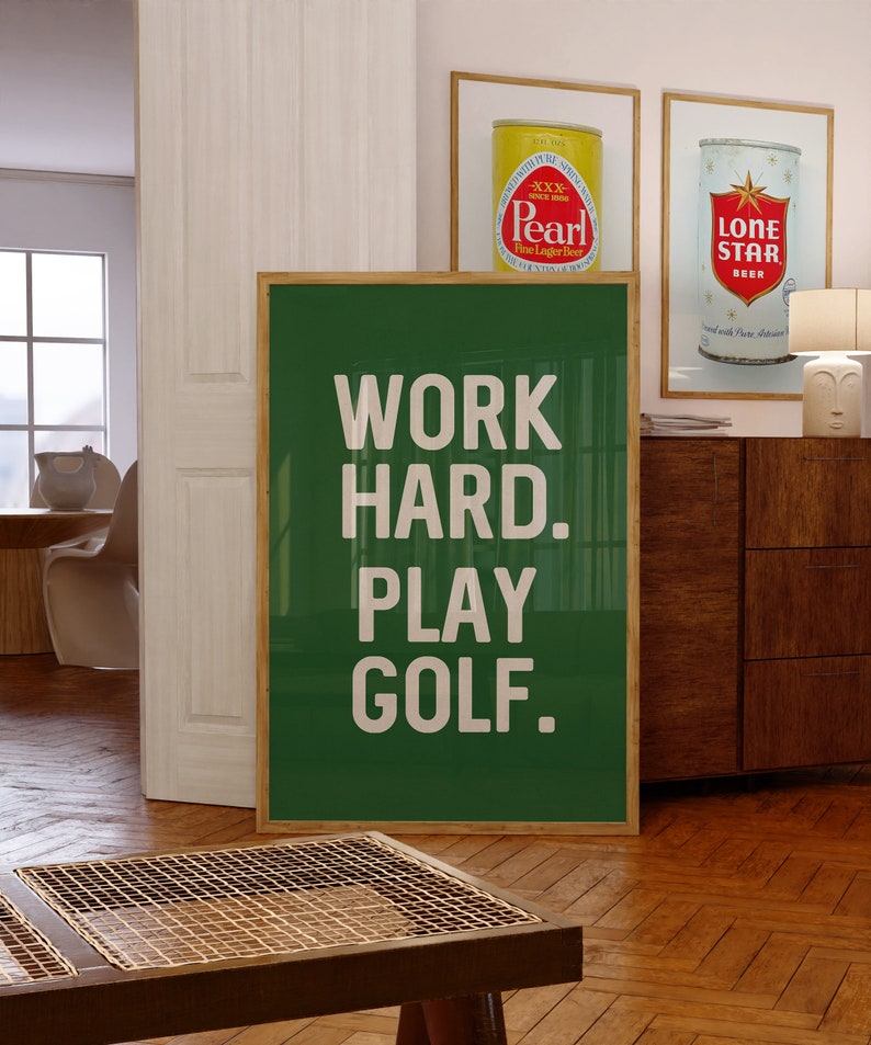 May include: A green poster with white text that reads "WORK HARD. PLAY GOLF."
