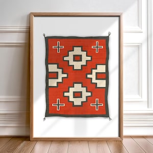 May include: A framed print of a red, white, and black geometric pattern. The pattern is reminiscent of a Native American rug or blanket.