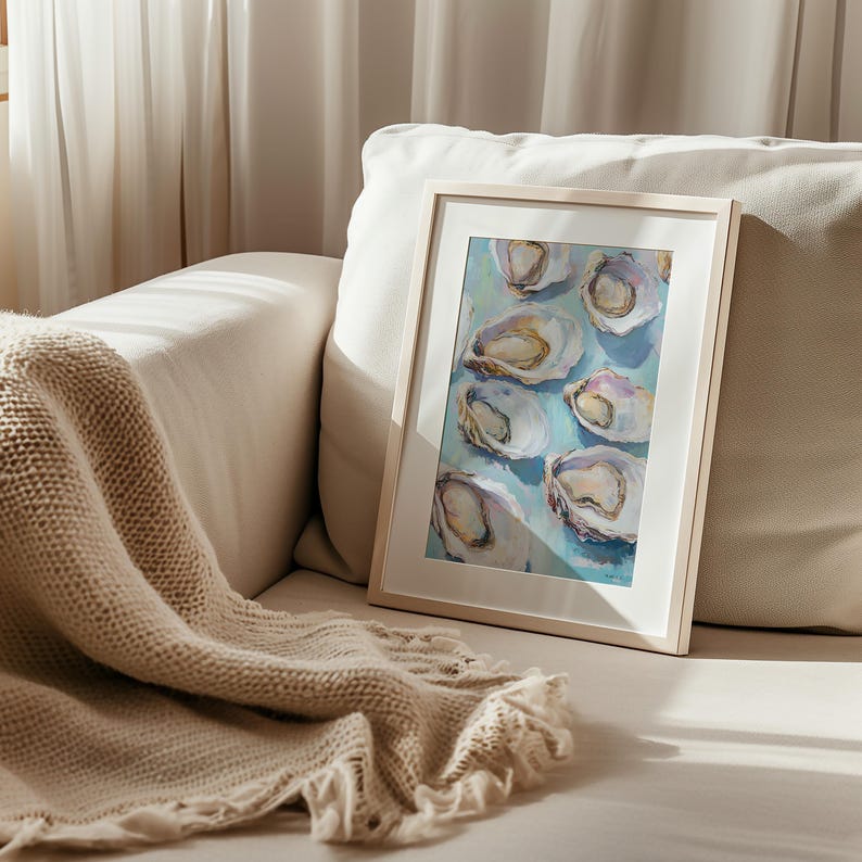 May include: A framed painting of oysters on a light blue background. The oysters are arranged in a random pattern and are painted in shades of white, gray, and beige.