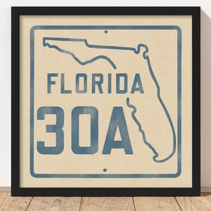 May include: A vintage-style sign with a blue outline of the state of Florida and the text "FLORIDA 30A" in blue.