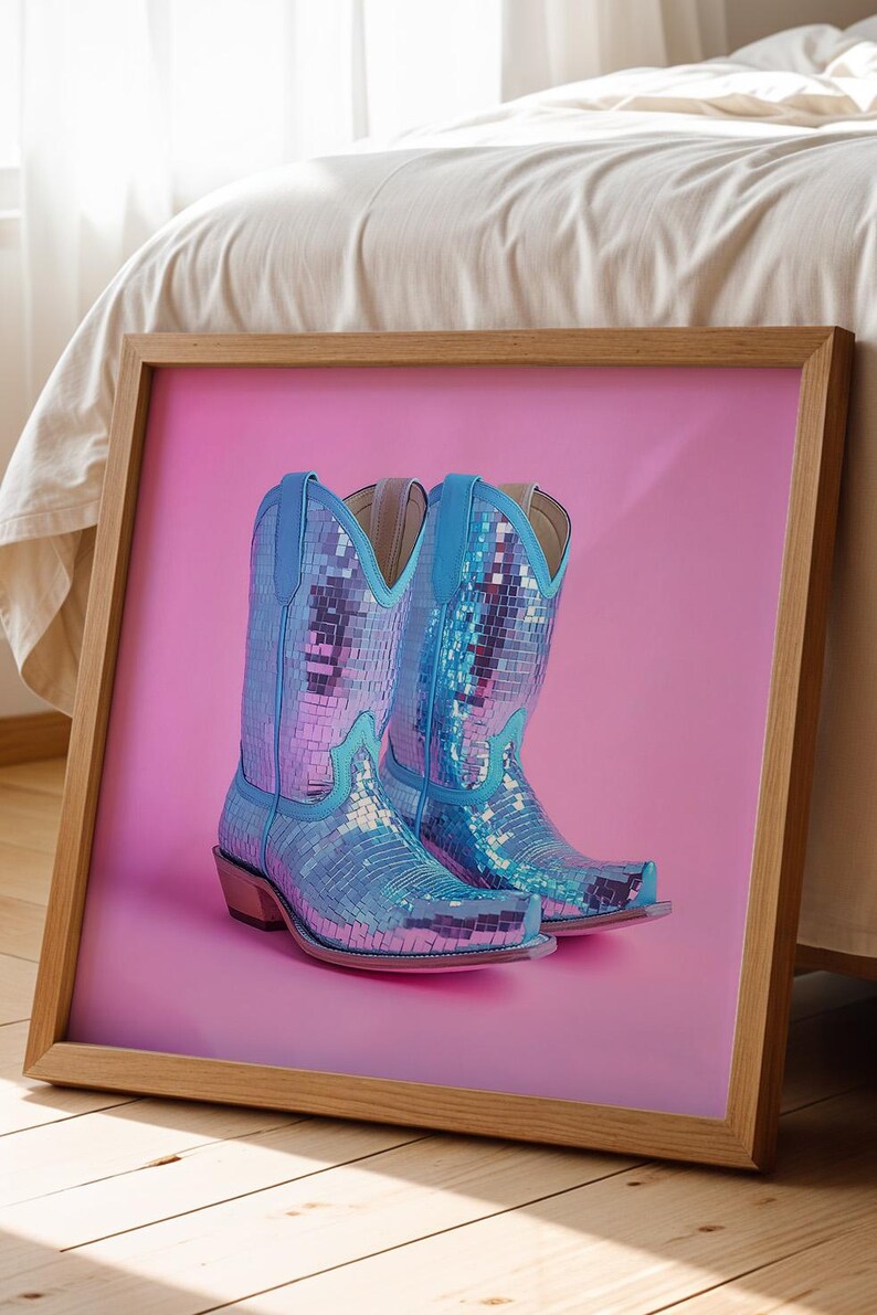 May include: A pair of blue cowboy boots with iridescent sequins on a pink background.