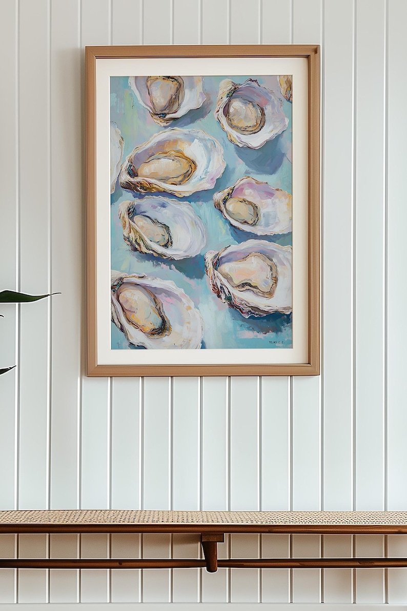 May include: A framed painting of a cluster of oysters on a light blue background. The oysters are painted in a realistic style with shades of white, pink, and yellow.