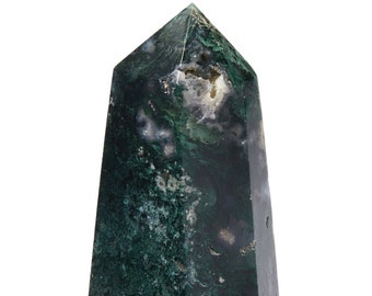 May include: A green moss agate crystal point with a pointed tip and a flat base. The crystal has a dark green color with white and gray inclusions.