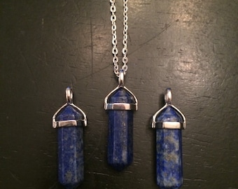 May include: Three silver chain necklaces with blue lapis lazuli crystal point pendants.