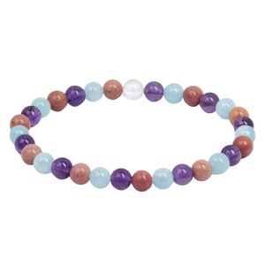 May include: A multi-colored beaded bracelet with amethyst, aquamarine, rose quartz, and clear quartz beads.