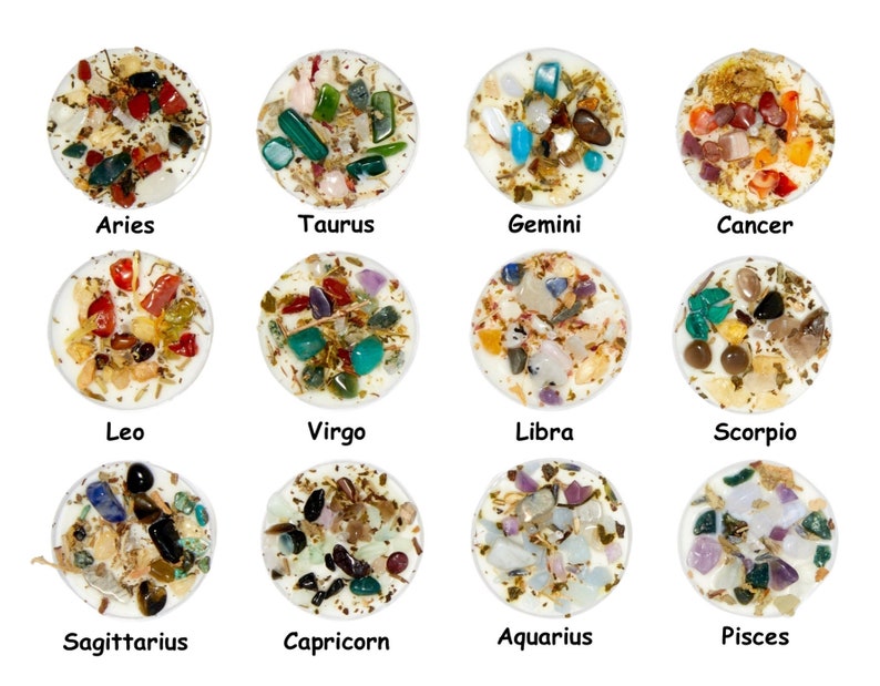 May include: Twelve small white candles with different colored crystals and herbs embedded in the wax. Each candle is labeled with a zodiac sign: Aries, Taurus, Gemini, Cancer, Leo, Virgo, Libra, Scorpio, Sagittarius, Capricorn, Aquarius, and Pisces.