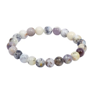May include: A bracelet made of white, gray, and purple opal beads.