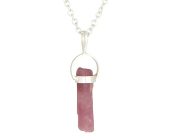 May include: A silver chain necklace with a pendant featuring a raw pink crystal point.