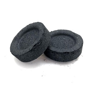 May include: Two black charcoal discs for shisha or hookah smoking.