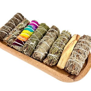 a wooden tray filled with lots of different types of sticks
