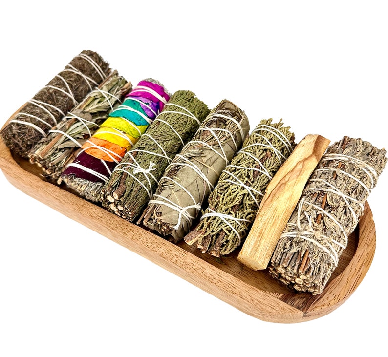 a wooden tray filled with lots of different types of sticks