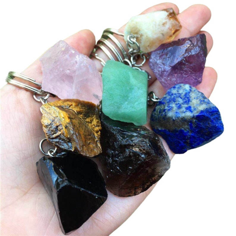 a person holding a bunch of rocks in their hand