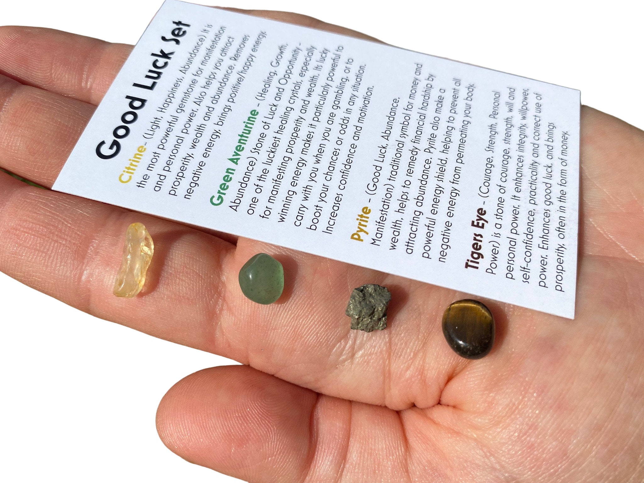 Close-up of prosperity crystals including citrine, green aventurine, and pyrite for money witchcraft.