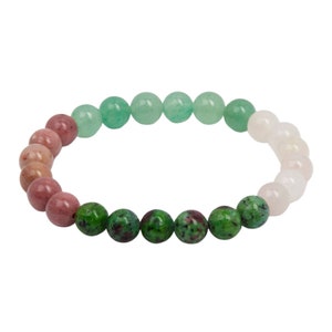 May include: A multi-colored beaded bracelet with pink, green, and white beads. The bracelet is made of natural stones.