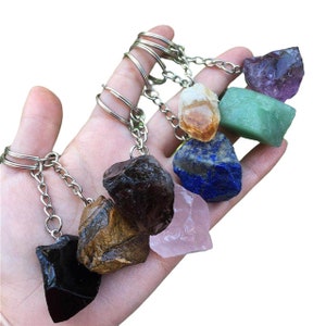 a person holding a bunch of rocks in their hand