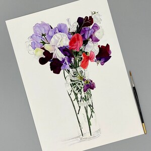 A3 size giclee print of sweet pea flowers in a Peroni beer glass laying next to a paint brush.