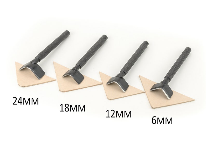 May include: Four leather punch tools with black handles, arranged in a row from largest to smallest. The tools are labeled 24MM, 18MM, 12MM, and 6MM.