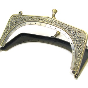 Contemporary Purse frame antique gold scroll pattern 5" (12.7cm) x 3" (7.6cm) with handle holes, sew holes ad friction closure