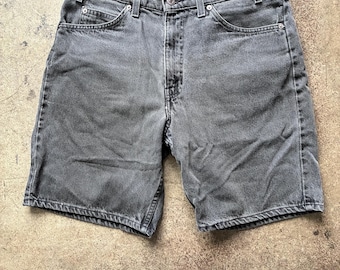 Vintage 80's Levi’s 550 faded black denim jean shorts | Waist 33” (tag size) Waist 33” (measured size) | Orange tab