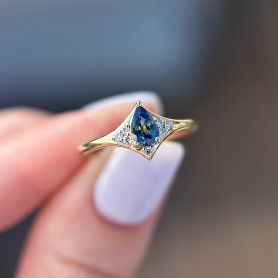 Custom-made 14K Yellow gold Aurora ring with Pear Sapphire and Diamonds