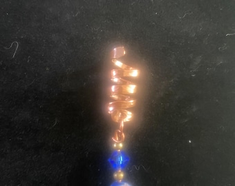 Copper spiral dreadlock cuff with beads and gems.