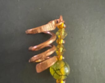 Copper spiral dreadlock cuff with beads and gems.