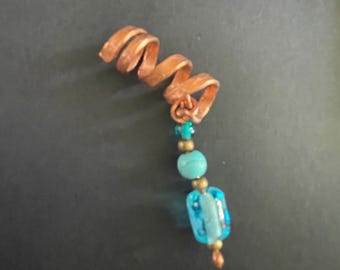 Copper spiral dreadlock cuff with beads and gems.