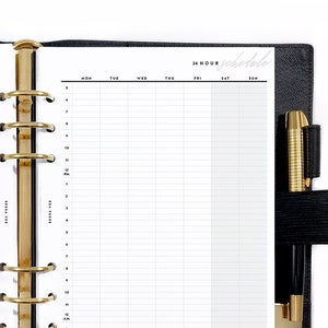 May include: Open black leather planner with gold-colored rings and a pen. The planner is open to a 24-hour schedule layout with a grid for each day of the week. The word "schedule" is written in cursive at the top.
