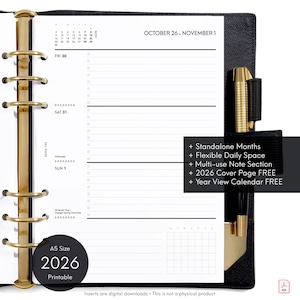 May include: A5 size 2026 printable planner insert with a black cover and gold accents. The open planner shows a weekly layout with space for notes and a calendar view. Text includes "Standalone Months" and "Year View Calendar FREE."