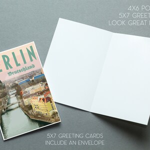 May include: A greeting card featuring a vintage-style illustration of the Berlin skyline with the text "BERLIN Deutschland". The card is folded in half and has a blank inside for writing a message. 5x7 greeting cards include an envelope.
