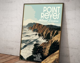 May include: A vintage-style poster for Point Reyes National Seashore, featuring a scenic view of the rugged coastline with crashing waves and a rocky cliff. The poster is in a brown frame and has the text "Point Reyes National Seashore" and "U.S. National Park Service" printed on it.