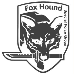 May include: Black and white illustration of a fox's head with a knife in front of it. The text "Fox Hound Special Force Group" is written on the right side of the image.