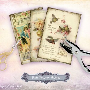 May include: A collection of 10 vintage calendar tags with floral and bird illustrations, and a boy in a blue suit. Gold scissors and a silver hole punch are also in the image. The text on the tags includes "W.M. Watson Co." and "Pixie Treasures Designs."