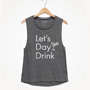 May include: A gray sleeveless shirt with the text "Let's Day Drink" and a white silhouette of a margarita glass with a lime wedge.