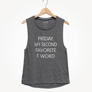 May include: A dark gray sleeveless shirt with the text "FRIDAY. MY SECOND FAVORITE F WORD" printed in white.