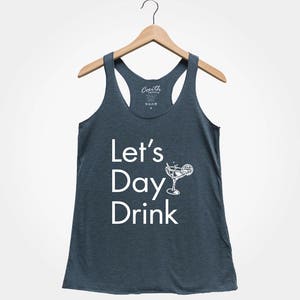 May include: A dark blue tank top with the text "Let's Day Drink" and a white illustration of a cocktail glass with a lime wedge.