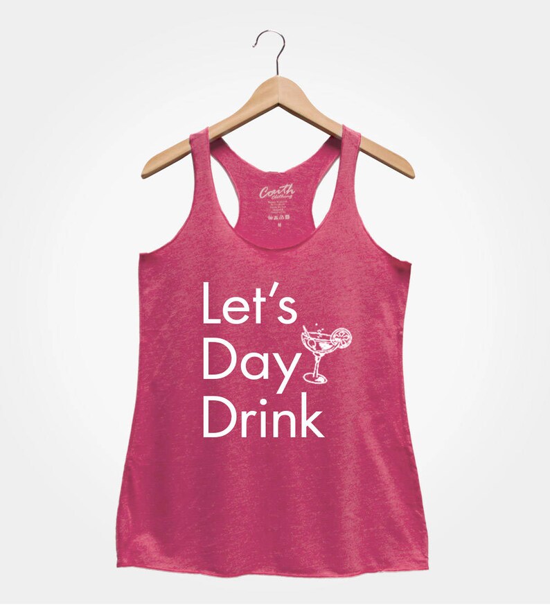 May include: Pink racerback tank top with the text "Let's Day Drink" and a white illustration of a margarita glass with a lime wedge.