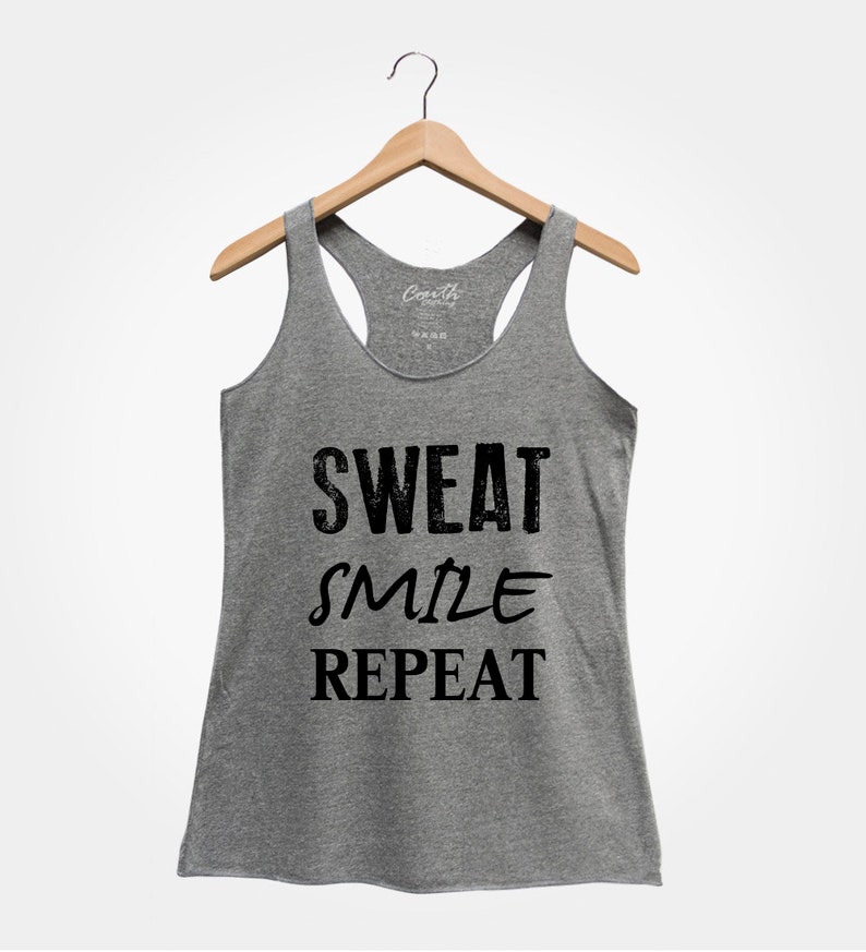 May include: Gray tank top with the text "SWEAT SMILE REPEAT" printed in black.