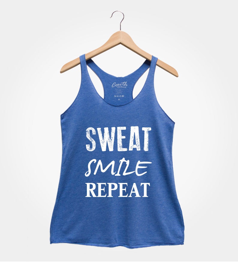 May include: A blue tank top with the text "SWEAT SMILE REPEAT" in white.