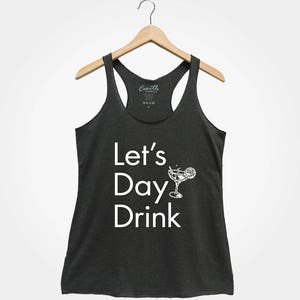 May include: A dark gray tank top with the text "Let's Day Drink" in white lettering and a white illustration of a margarita glass with a lime wedge.